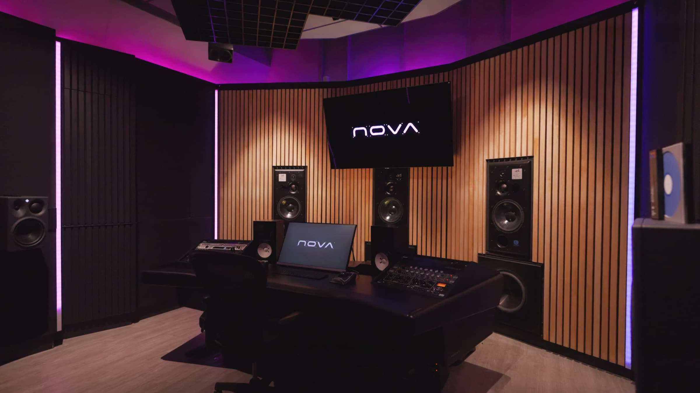 The NOVA Studios Dolby Atmos control room lit in purple